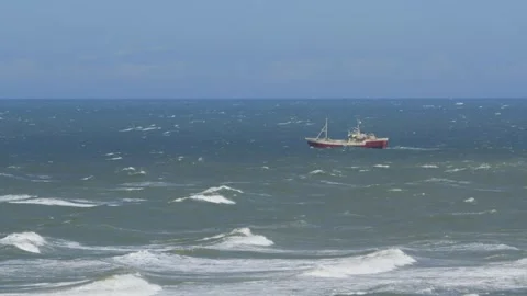 Hirthals, Denmark - July 06, 2026: Fishing trawler boat in rough stormy sea Stock Footage 338329583