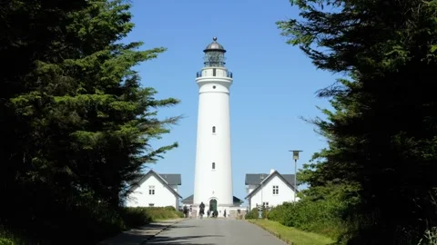Hirtshals lighthouse in denmark framed by trees Stock Footage 338328715