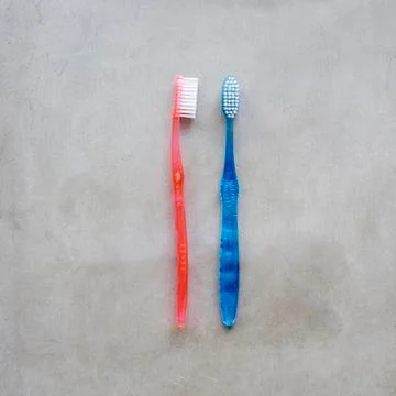 His and hers toothbrushes Stock Photos