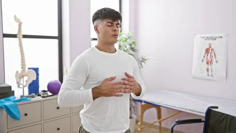 At his balance point, a portrait of a young, handsome hispanic man finding .. Stock Footage 258024481