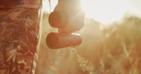 His binoculars are almost as important as his bow Stock Footage 101128720