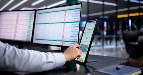 Hispanic Accountant Analyzing Financial Data On Business Desktop Monitor Stock Photos