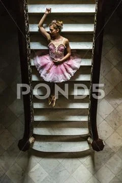 Hispanic Ballet Dancer Posing On Staircase