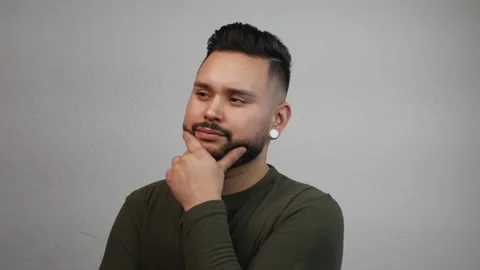 Hispanic Bearded Young Man Standing in Place Thinking Profoundly Stock Footage 173347006