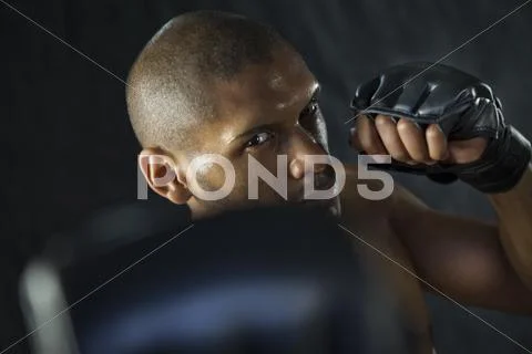 Hispanic boxer warming up Stock Photos