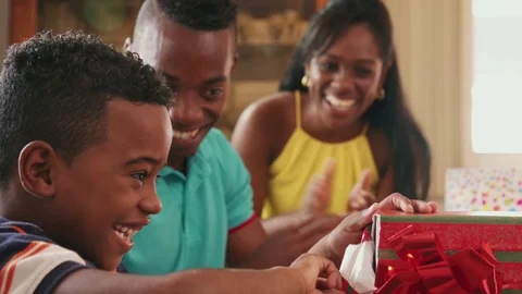 Hispanic Boy Opening Gift Box Happy Black Child Celebrating Birthday Stock Footage 72665145