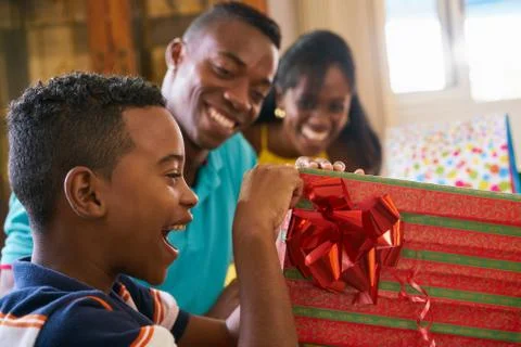 Hispanic Boy Opening Gift Box Happy Black Child Celebrating Birthday Stock Photos
