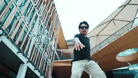 Hispanic break dancer dance at camera with low angle camera. Mall. Endeavor. 库存照片