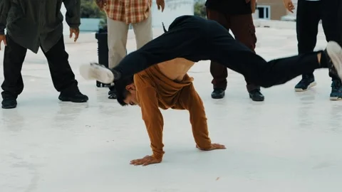 Hispanic break dancer practice B boy dance with friends at roof top. hiphop. Stock Footage 258203519