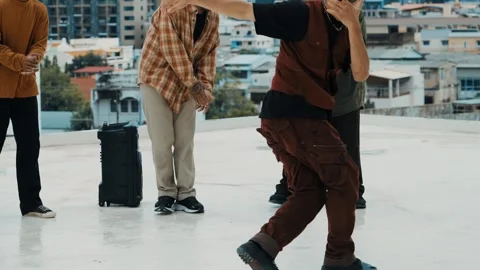 Hispanic break dancer practice B boy dance with friends at roof top. hiphop. Stock Footage 258624842
