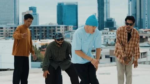 Hispanic break dancer practice B boy dance with friends at roof top. hiphop. Stock Footage 264141528