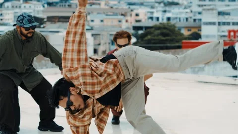Hispanic break dancer practice B boy dance with friends at roof top. hiphop. Stock Footage 264483189
