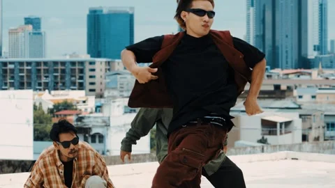 Hispanic break dancer practice B boy dance with friends at roof top. hiphop. Stock Footage 264977586