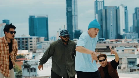 Hispanic break dancer practice B boy dance with friends at roof top. hiphop. Stock Footage 266064677