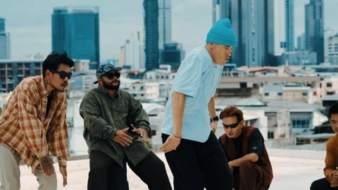 Hispanic break dancer practice B boy dance with friends at roof top. hiphop. Stock Footage 266949275