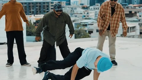 Hispanic break dancer practice B boy dance with friends at roof top. hiphop. Stock Footage 268338963