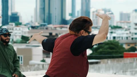 Hispanic break dancer practice B boy dance with friends at roof top. hiphop. Stock Footage 269547274