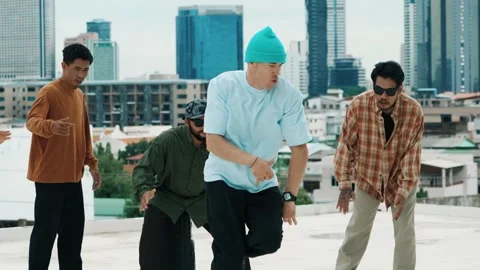 Hispanic break dancer practice B boy dance with friends at roof top. hiphop. Stock Footage 269985542