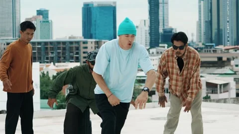 Hispanic break dancer practice B boy dance with friends at roof top. hiphop. Stock Footage 271664818