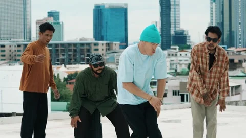 Hispanic break dancer practice B boy dance with friends at roof top. hiphop. Stock Footage 273934883