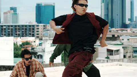 Hispanic break dancer practice B boy dance with friends at roof top. hiphop. Stock Footage 274930470