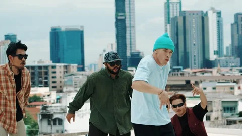 Hispanic break dancer practice B boy dance with friends at roof top. hiphop. Stock Footage 275568950