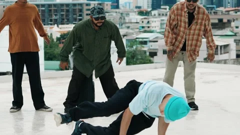 Hispanic break dancer practice B boy dance with friends at roof top. hiphop. Stock-Footage 277023860