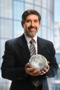 Hispanic businessman holding earth Stock Illustration