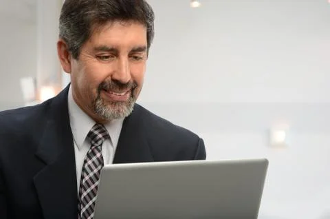 Hispanic Businessman Using Laptop Stock Photos
