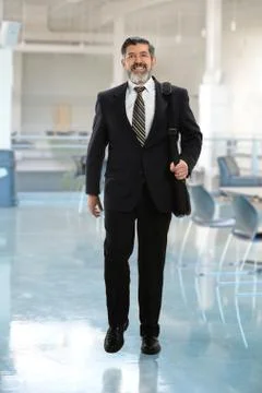 Hispanic Businessman Walking Stock Photos