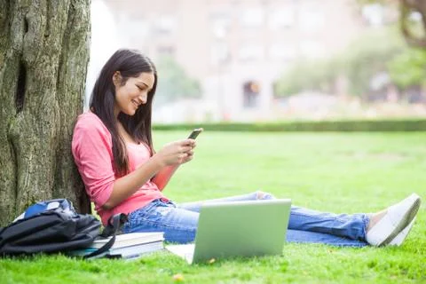 Hispanic college student texting Stock Photos