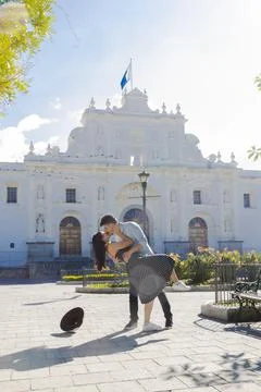 Hispanic couple dancing in front of the San José cathedral in Antigua Guatemala Stock Photos