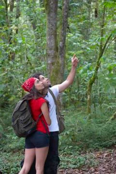 Hispanic couple exploring forest together Fotos Stock