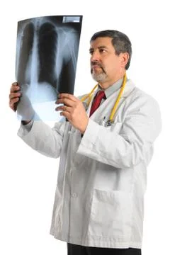 Hispanic doctor looking at x-ray Stock Photos
