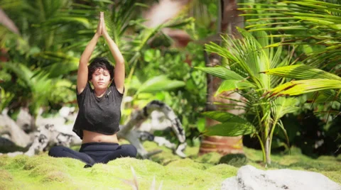 Hispanic does yoga on garden Stock Footage 37091828