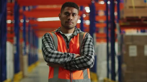 Hispanic employee in the warehouse looking at the camera Stock Footage 264081238