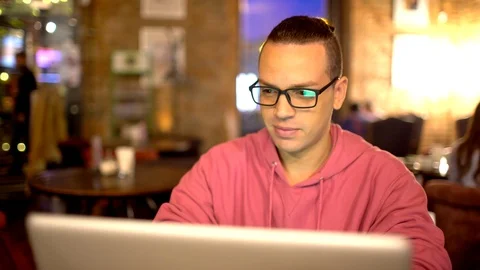 Hispanic Ethnicity Young Man using Laptop Computer at Cozy Coffee Shop. Stock Footage 88832350