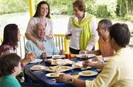 Hispanic family enjoying meal together Stock Photos