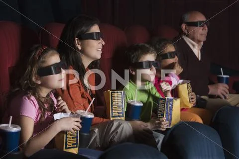Hispanic Family Watching 3D Movie