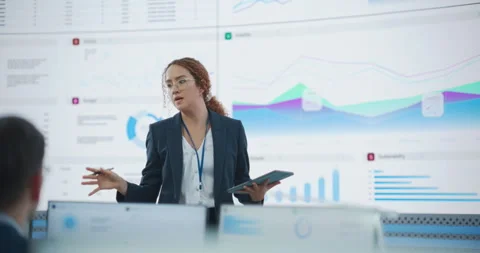 Hispanic Female Manager Talks To Data Analysis Employees Stock Footage 243706497