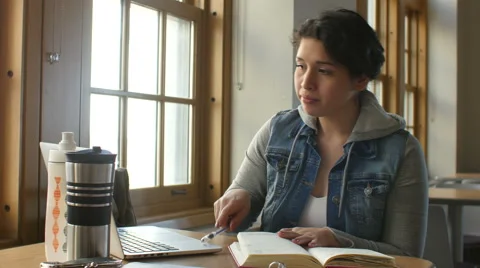 Hispanic female studying, writing notes Video stock 48523417