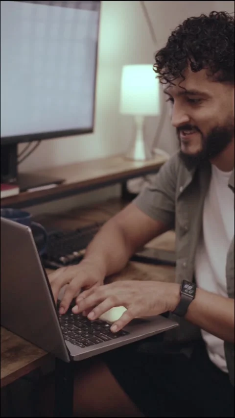 Hispanic freelancer typing on laptop at home office desk Stock Footage 341498083