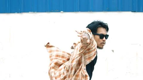 Hispanic funny choreographer dancing in hip hop style. Modern dance. Endeavor. Stock Photos