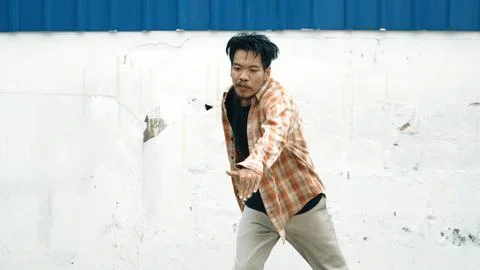 Hispanic funny choreographer dancing in hip hop style. Modern dance. Endeavor. Stock Photos