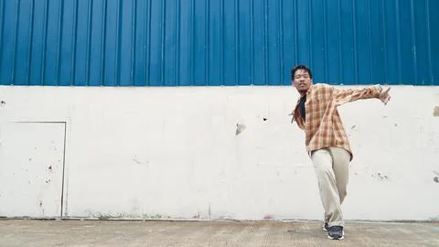 Hispanic funny choreographer dancing in hip hop style. Modern dance. Endeavor. Stock Photos