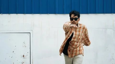 Hispanic funny choreographer dancing in hip hop style. Modern dance. Endeavor. Stock Photos
