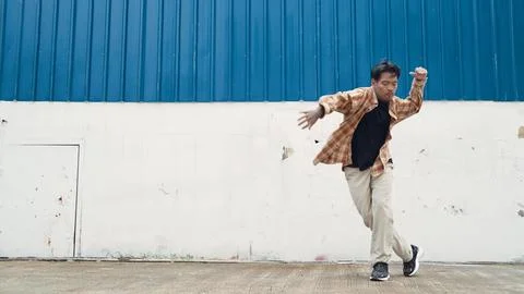 Hispanic funny choreographer dancing in hip hop style. Modern dance. Endeavor. Stock Photos