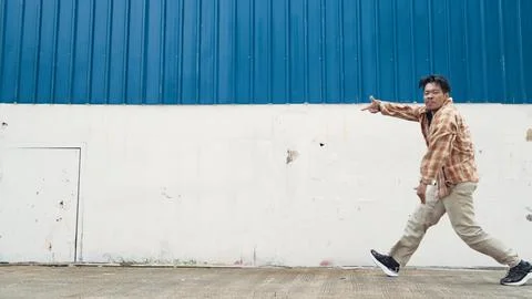 Hispanic funny choreographer dancing in hip hop style. Modern dance. Endeavor. Stock Photos