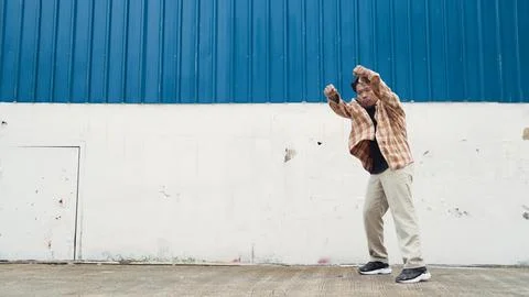Hispanic funny choreographer dancing in hip hop style. Modern dance. Endeavor. Stock Photos