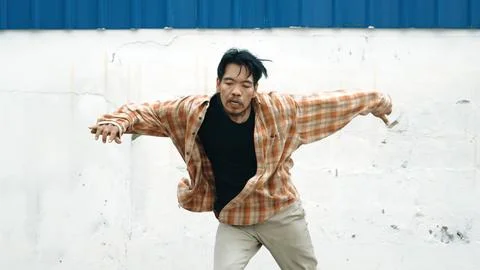 Hispanic funny choreographer dancing in hip hop style. Modern dance. Endeavor. Stock Photos